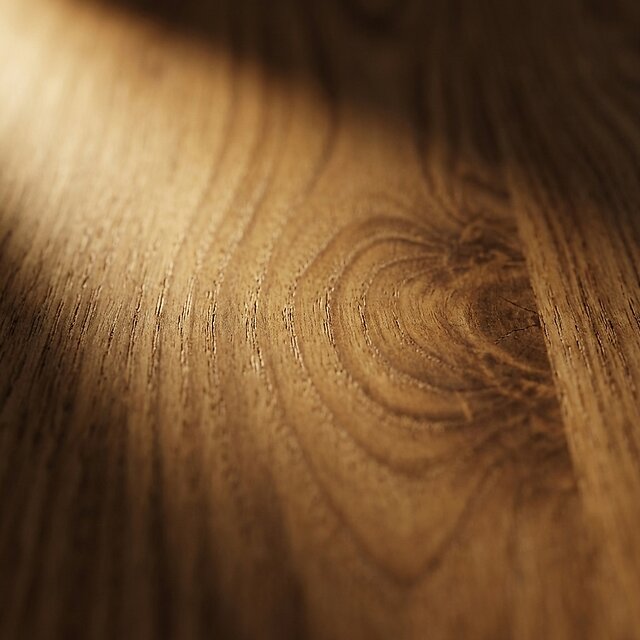 Oiled walnut wood surface showing rich grain detail