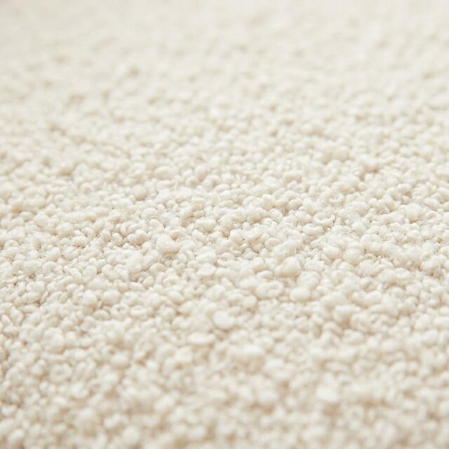 Cream bouclé fabric texture in close-up